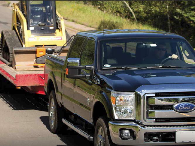 Ford pick-up pulling BobCat